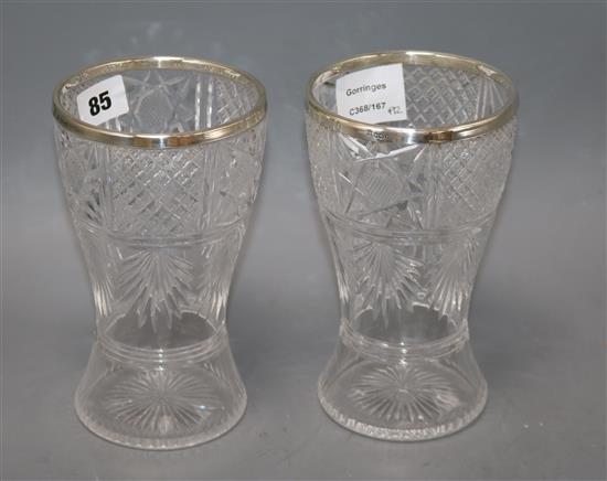 A pair of silver mounted cut glass vases height 18cm